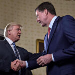 President Donald Trump shakes hands with FBI Director James Comey